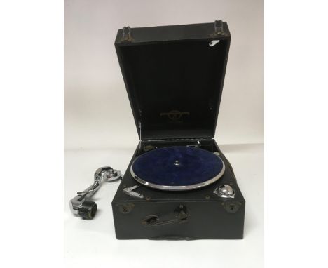 A Columbia portable gramophone with a small collection of 78 records. In need of restoration, a/f.