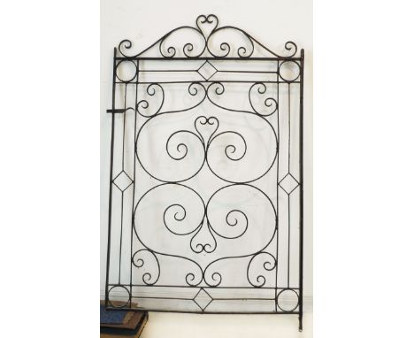 A wrought-iron gate with decorative scrollwork (113 cm wide x 180 cm high).