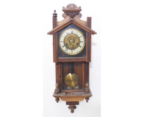 A late 19th century wall-hanging eight-day clock for restoration; cream chapter ring with Roman numerals and the movement str