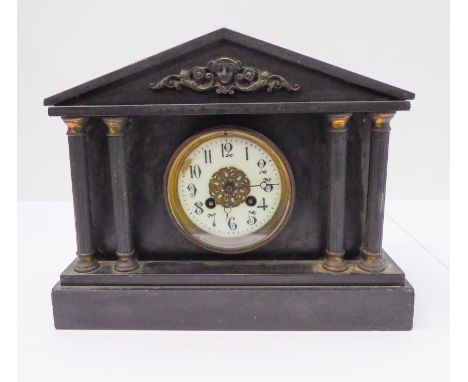A late 19th century black slate eight-day mantle clock of architectural inspiration: cream dial with Arabic numerals flanked 