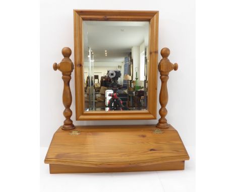 A modern pine toilet mirror with angular compartment below