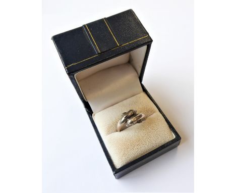 A silver dress ring modelled as two dolphins, ring size N (boxed)