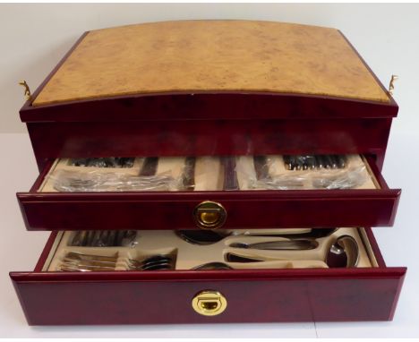 A fine SBS eight-place stainless steel flatware and cutlery service. (As new - never used). The dome topped wooden lid openin
