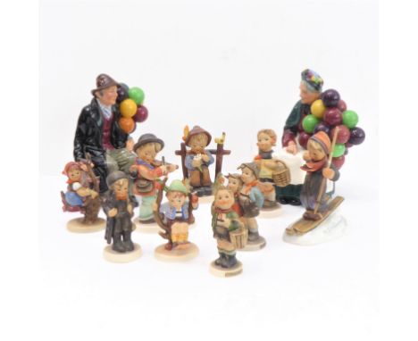 Nine Goebel-style figures (mostly marked) and two Royal Doulton figures, 'The Balloon Man' (HN 1954) and 'The Old Balloon Sel