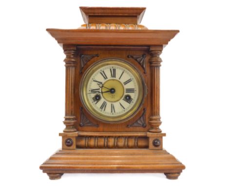 A late 19th century German eight-day mantle clock: the cream chapter ring with Roman numerals; the movement striking on a gon
