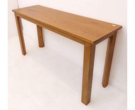 A modern light oak side table on square legs (147.5 x 46 x 76 cm high)