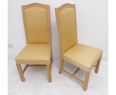 A pair of modern light oak and gold upholstered side chairs with square fluted front legs