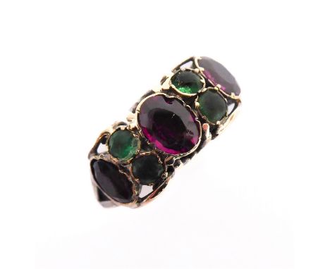 A vintage ring (possibly 19th century) set with seven coloured gemstones in yellow metal (boxed)