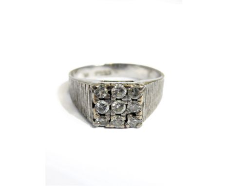 An 18-carat white gold ring set with nine diamonds,&nbsp;size M&nbsp;