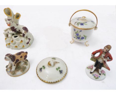 Four pieces of mostly 19th century porcelain:an early-style Staffordshire inkwell spill-vase modelled as a recumbent animal (