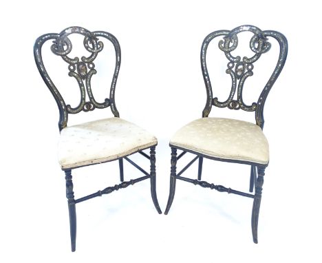A pair of Victorian ebonised and mother-of-pearl decorated hall chairs 