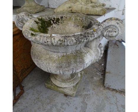 A weathered concrete 2-handled garden planter, overall width 70cm, H56cm 