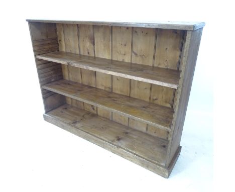 A Vintage pine low open bookcase, with 2 adjustable shelves, W123cm, H92cm, D27cm 