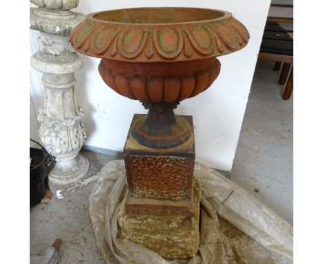 A pair of terracotta garden urns on stand, D47cm, height excluding plinth 70cm 