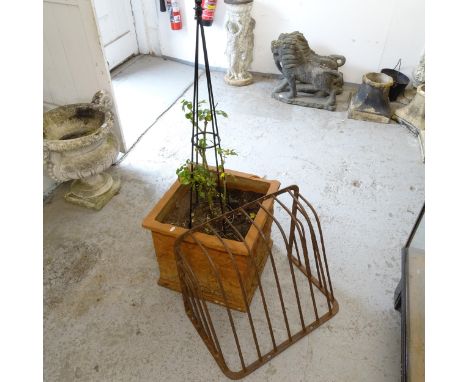 A large terracotta square garden planter, containing rose plant, W50cm, H45cm, and a hay rack
