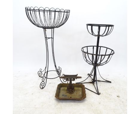 A cast iron boot scraper, a wirework plant stand and another painted metal plant stand (3) 
