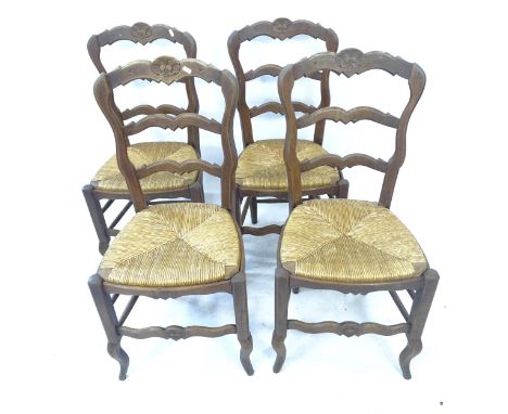 A set of 4 French oak rush-seated ladder-back dining chairs 