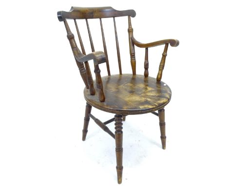 An Antique mahogany and elm-seated stick-back elbow chair 