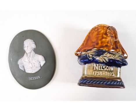 A Royal Doulton earthenware candlestick in the form of Nelson's hat, 10.5cm high, and a Jasperware plaque of Nelson, 11.5cm x