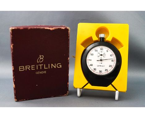 A boxed Breitling sprint stop watch, an open facet Elgin pocket watch and a cased Estyma travelling clock. Gross weight: 384.