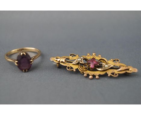 A stamped 9ct gold single stone amethyst ring together with an ornate amethyst and seed pearl bar brooch with base metal pin,