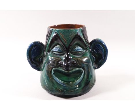 An R P Brannam pottery double faced  'Marriage' jug, incised marks to base and dated 1917, 16cm high