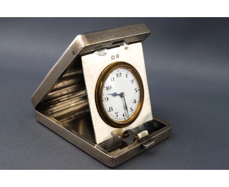 An engine turned silver travelling/bedside clock of rectangular form Birmingham 1928, 6.5 cms