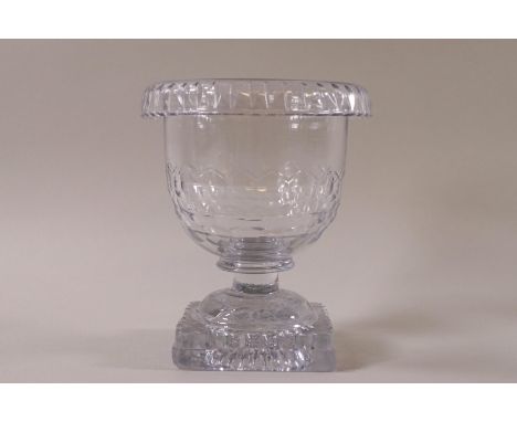 A large 19th Century cut glass salt with folded rim, triple row faceted bowl on square pedestal 'lemon squeezer' base, 11.5cm