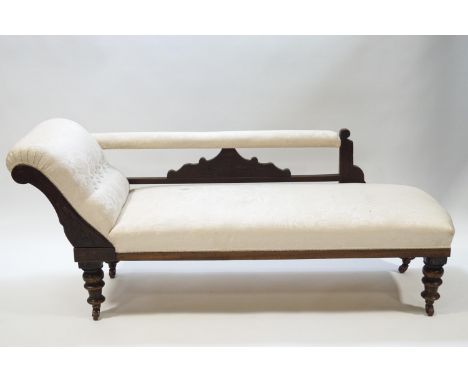 A Victorian mahogany chaise longue with button back cream upholstery, 177cm long