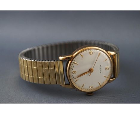 A 9ct gold Vertex wristwatch with silver dial having mixed markings. Manual wind movement. Case back stamped 9.375. On a gold