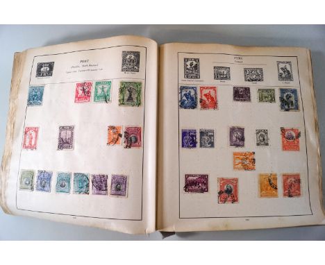 An old, well filled green Stamp album with Commonwealth and Foreign stamps