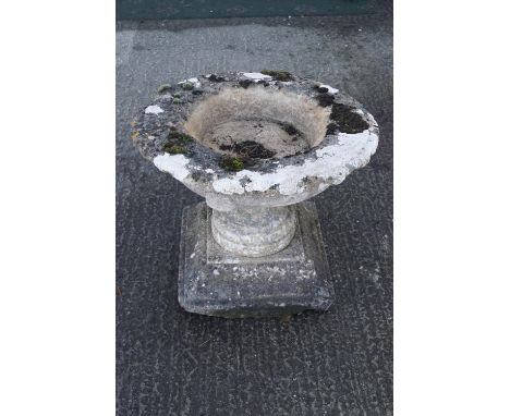 A large garden stone planter on pedestal base, weathered, 55cm high x 65cm diameter