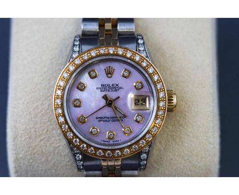 A ladies Rolex Oyster Perpetual with mother of pearl diamond dial, on a gold and steel Jubilee bracelet, in original box, wit