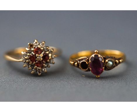 A hallmarked 9ct gold garnet and diamond cluster ring together with a hallmarked 22ct gold rhodolite garnet and seed pearl dr