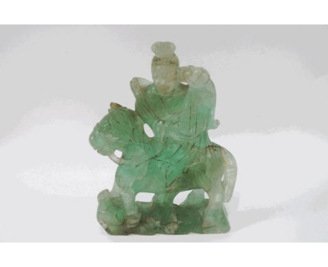 A Chinese carved jade figure on horseback, 19cm high