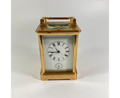 A carriage Clock marked 'BRADFORD' to the face:

- white dial with Roman numerals
- secondary dial for the alarm


Condition: