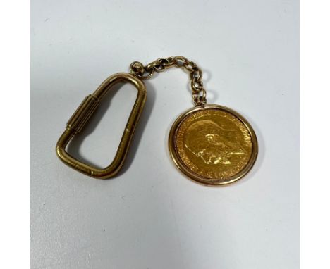 A George IV gold full sovereign dated 1912 in a 9ct mount on a gilt metal chain and a key ring, total weight approx 17.5grams