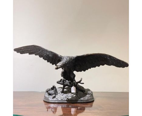 A large cast bronze eagle probably by Chris Schiller of Colorado: an award winning wildlife artist and sculptor. Indistinct c