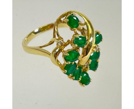 An 18ct yellow gold 750 emerald and diamond cluster ring. Size L. Approximately 5.3 grams