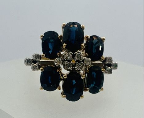*******REOFFER JANUARY 12 2024, ESTIMATE &pound;150 - &pound;250******
A sapphire and diamond cluster ring. Shank stamped 585