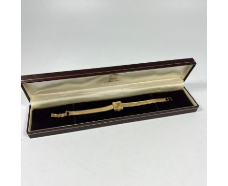 A 9ct yellow gold Tissot manual wind ladies bracelet wristwatch approx 18grams, some wear but running with box.