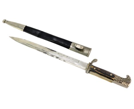 A Carl Blackthorn Solingen horn-handled dagger, with a bird moulded top, in a leather and steel scabbard, 42cm long.