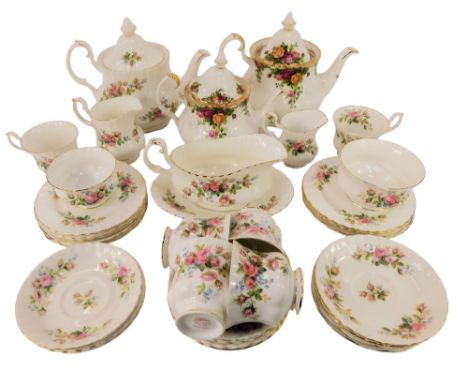 A Royal Albert Moss Rose pattern part tea service, comprising teapot, milk jug, two sugar bowls, six teacups, eleven saucers,