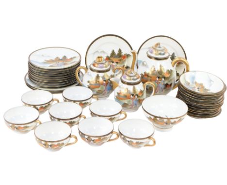 An early 20thC Japanese eggshell china tea service, with gilt decoration and landscape probably Mount Fuji and geishas.