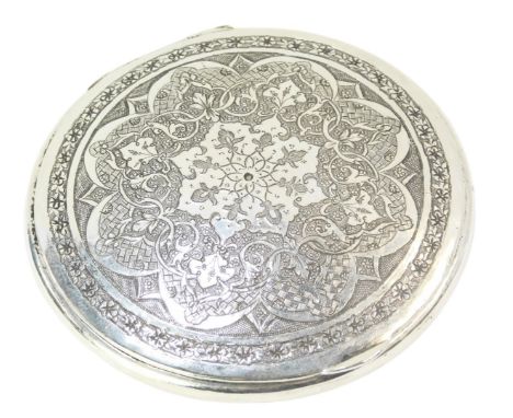An Eastern compact, the hammered design floral top, fitted with mirror, white metal unmarked, 7cm diameter, 3.34oz gross. 