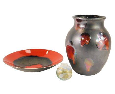 A Poole Galaxy pattern pottery vase, 25cm high, together with a Keramica pottery charger, in banded red and black colourway, 