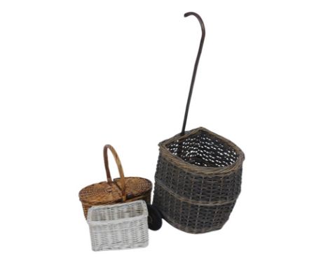 A wicker shopping trolley, with stick handle, on wheels, together with a wicker flower basket, etc.