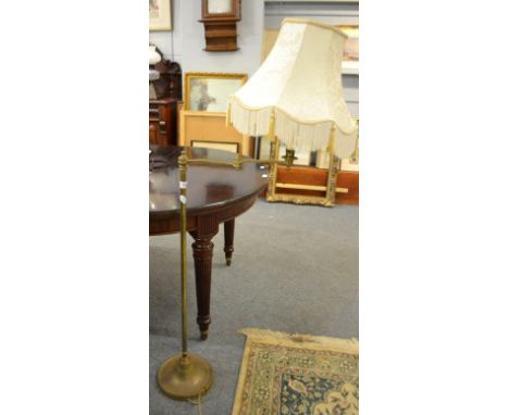 A brass standard lamp with adjustable arm, 132cm overall