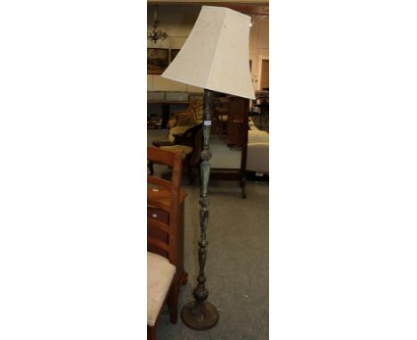 A patinated metal standard lamp