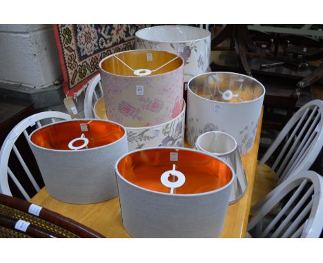 A quantity of decorative lamp shades.
